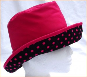 http://www.sunwiser.info/wp-content/uploads/2010/08/Fuchsia-Wax-Hat-with-Fuchsia-Spots-on-Black-Under-Brim-300x267.jpg